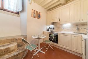 Кухня или мини-кухня в Campitelli Fascinating Apartment

