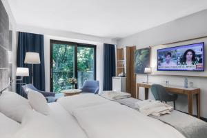 TV a/nebo společenská místnost v ubytování Hotel Testa