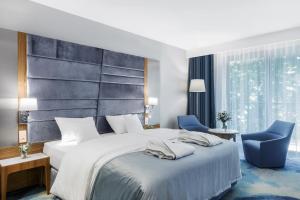 Postel nebo postele na pokoji v ubytování Hotel Testa