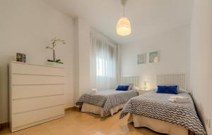 Posteľ alebo postele v izbe v ubytovaní Apartamento Daniel