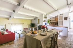 a living room with a table with a bowl of fruit on it at Domaine Sesquier Mas d'exception Acacia in Mèze