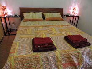 Un pat sau paturi într-o cameră la Etna Hiking B&B