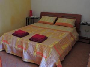 A bed or beds in a room at Etna Hiking B&B