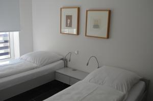 Dünenblick Apartments tesisinde bir odada yatak veya yataklar