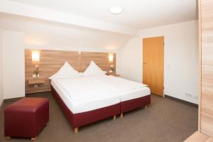 Postel nebo postele na pokoji v ubytování Hotel Schützenburg