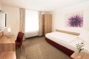 Postel nebo postele na pokoji v ubytování Hotel Schützenburg