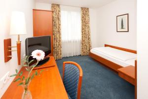 Postel nebo postele na pokoji v ubytování Hotel Schützenburg