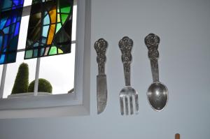 a table topped with a pair of scissors next to a window at The Old Chapel Boutique B&B in Towcester