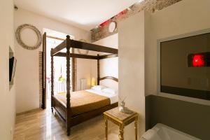 מיטה או מיטות בחדר ב-Nerva Accomodation Cavour