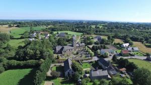 an aerial view of a house in a village at La Merveille in Le Luot