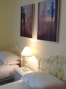 A bed or beds in a room at The Devonian 