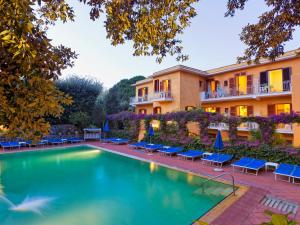 a view of a hotel with a swimming pool at Hotel Cleopatra in Ischia