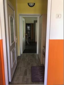 an empty hallway with an open door and a hallwayngthngthngthngthngthngth at Apartma Mahnič in Postojna