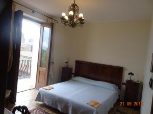 Postel nebo postele na pokoji v ubytování Castello di Altomonte