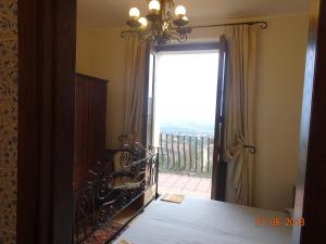 Postel nebo postele na pokoji v ubytování Castello di Altomonte