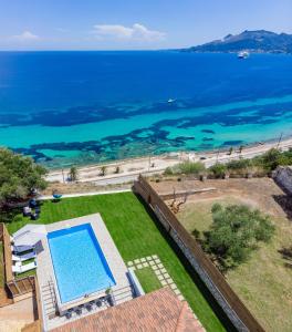 an aerial view of a swimming pool and the ocean at VΙLLA ANNA-MARIA in Zakynthos Town