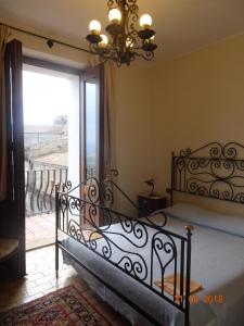 Postel nebo postele na pokoji v ubytování Castello di Altomonte