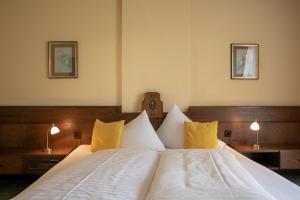 Postel nebo postele na pokoji v ubytování Hotel Kanz