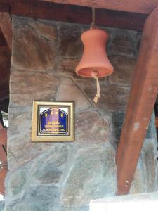 a picture on a stone wall with a light and a lamp at Seosko domacinstvo Imunsan in Niš