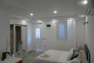 Ένα ή περισσότερα κρεβάτια σε δωμάτιο στο Apartments Sabioncello