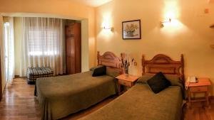 Postel nebo postele na pokoji v ubytování Hotel A Nieu