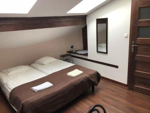 Posteľ alebo postele v izbe v ubytovaní Apartamenty i Pokoje Na Letniej