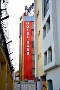 a building with a colorful sign on the side of it at Hotel Saad in Kolkata