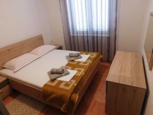 Postel nebo postele na pokoji v ubytování Apartment Krišković
