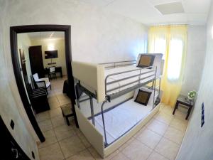 Rúm í herbergi á Piccolo Hotel Nogara