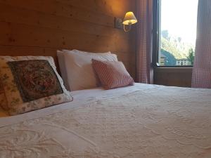 Postel nebo postele na pokoji v ubytování Hotel Pedretti