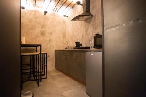 a kitchen with a sink and a counter top at Vysoka Khata1 in Lviv