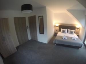 Łóżko lub łóżka w pokoju w obiekcie Silver Residence