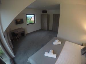 Łóżko lub łóżka w pokoju w obiekcie Silver Residence