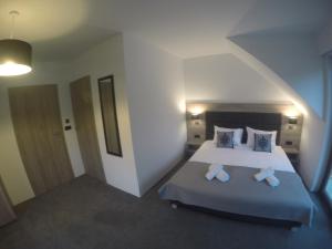 Łóżko lub łóżka w pokoju w obiekcie Silver Residence