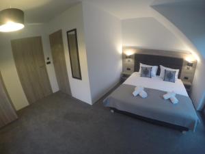 Łóżko lub łóżka w pokoju w obiekcie Silver Residence