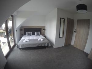 Łóżko lub łóżka w pokoju w obiekcie Silver Residence