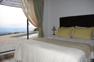 Postel nebo postele na pokoji v ubytování Monte Abi Mirador