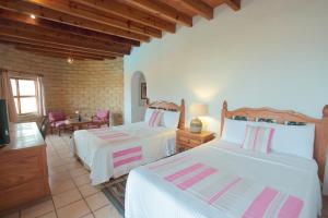 Posada del Tepozteco - Hotel & Gallery客房内的一张或多张床位