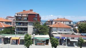 a group of tall buildings in a city at Despina in Nesebar