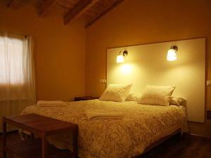 Un pat sau paturi într-o cameră la Villabamba