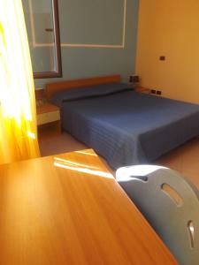 Кровать или кровати в номере Hotel Ristorante Al Canto delle Sirene
