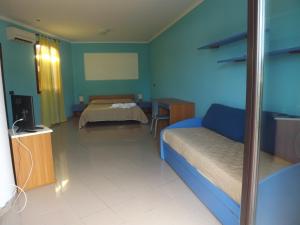 Кровать или кровати в номере Hotel Ristorante Al Canto delle Sirene