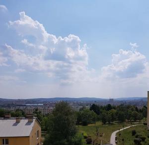 a view of a city with clouds in the sky at Słoneczny in Kielce