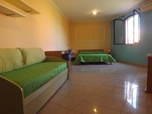 Кровать или кровати в номере Hotel Ristorante Al Canto delle Sirene