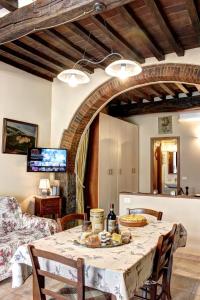 a dining room with a table with food on it at Casa Billi in Figline Valdarno