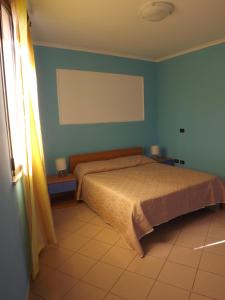 Кровать или кровати в номере Hotel Ristorante Al Canto delle Sirene