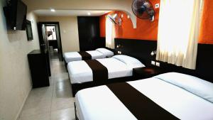 Postel nebo postele na pokoji v ubytování Hotel & Suites Domani