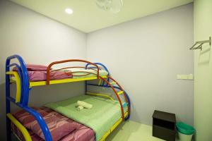 a childs bedroom with bunk beds in a room at Resort Hostel In City in Kuala Lumpur +64 photos
