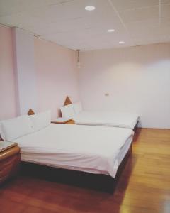 Postel nebo postele na pokoji v ubytování Pu Shi Homestay