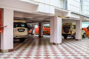 a parking lot with an old car parked inside at Hotel Biswanath in Guwahati